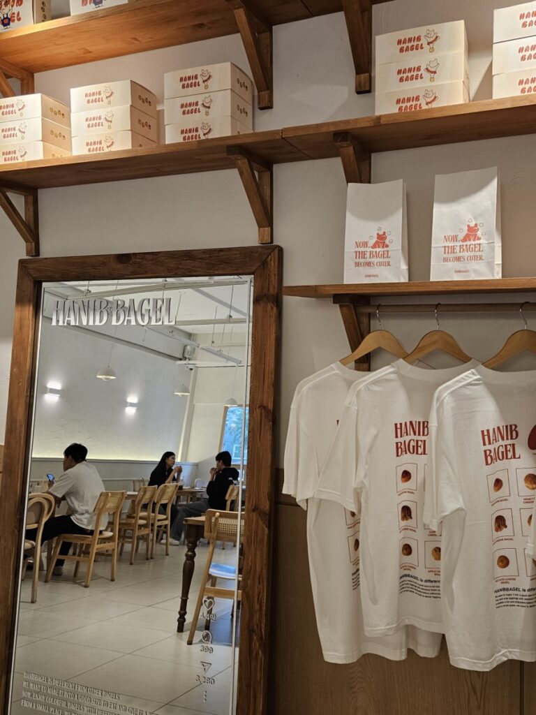 Hanib Bagel Seongsu interior with bagel boxes, mirror, and merchandise