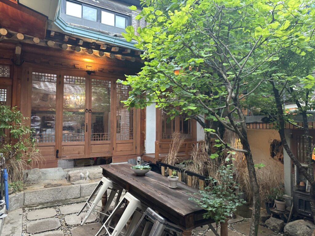 Interior of Hanok cafe in Hongdae Eum 1966 with wooden beams and classic decor