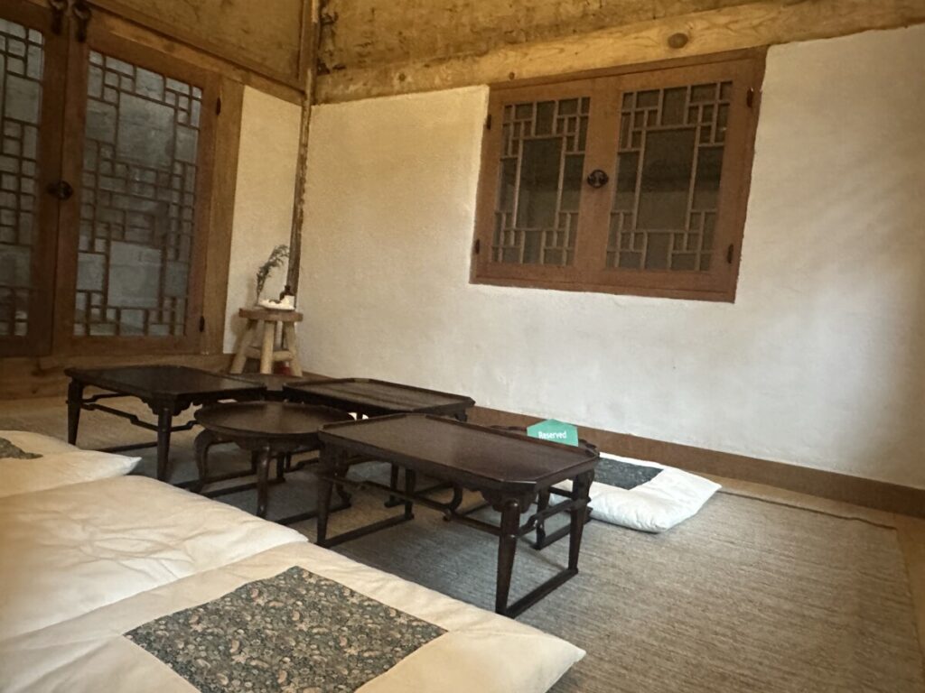 Interior of Hanok cafe in Hongdae Eum 1966 with wooden beams and classic decor