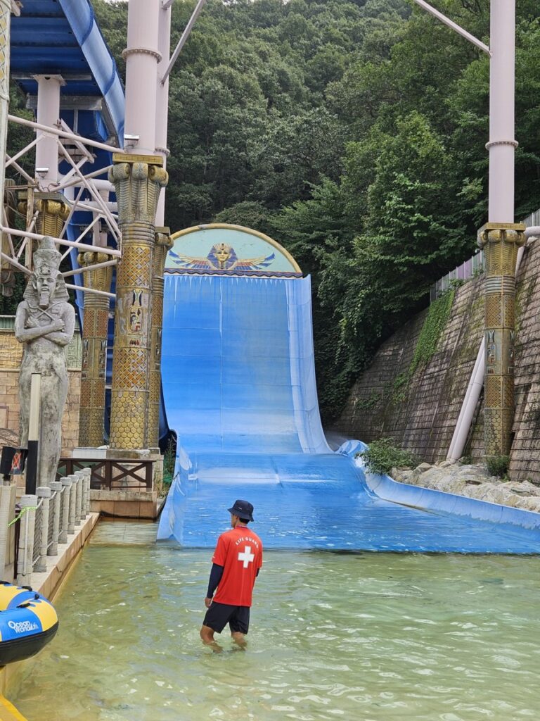 Lifeguard watching Super Boomerango water slide at Ocean World Korea
