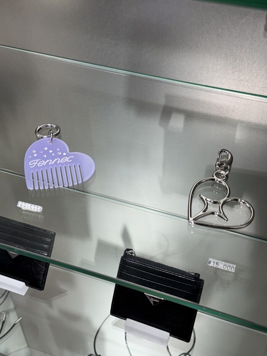 Heart-shaped Fennec keyrings and minimalist black cardholder displayed inside the Fennec Seongsu Flagship Store