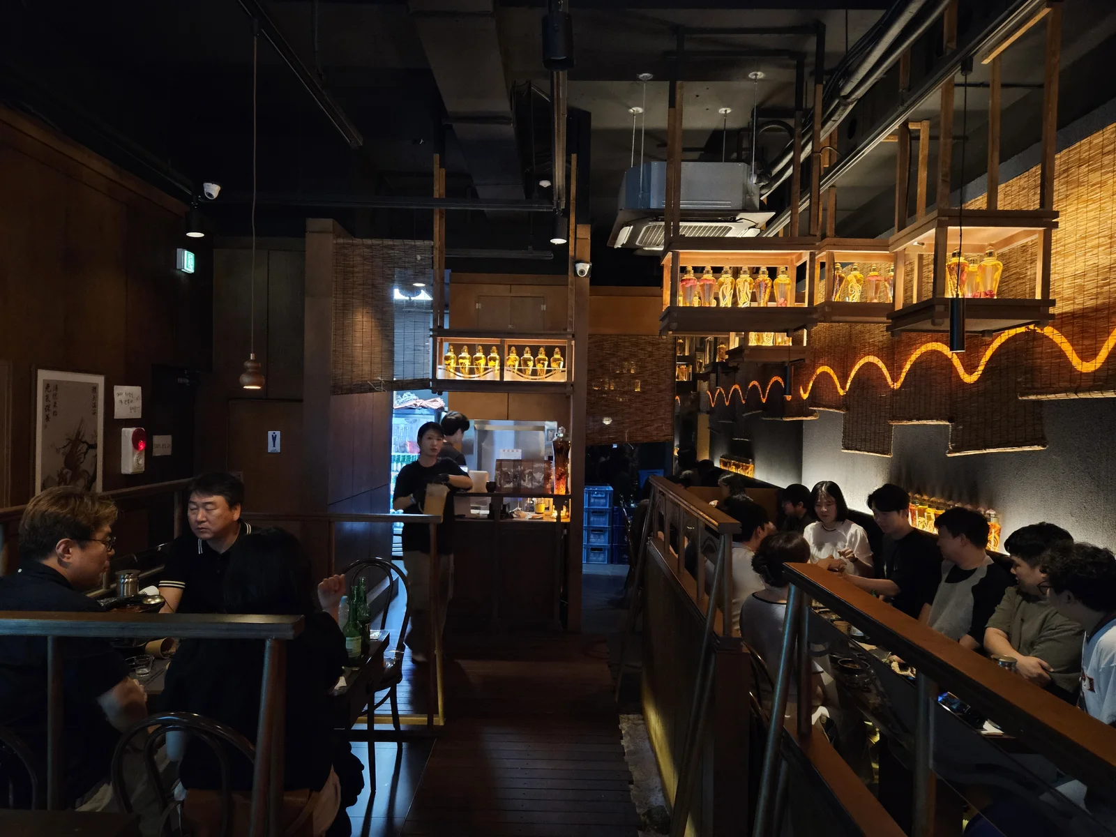 Dim wooden interior of Ari Valley Jonggak filled with after-work diners