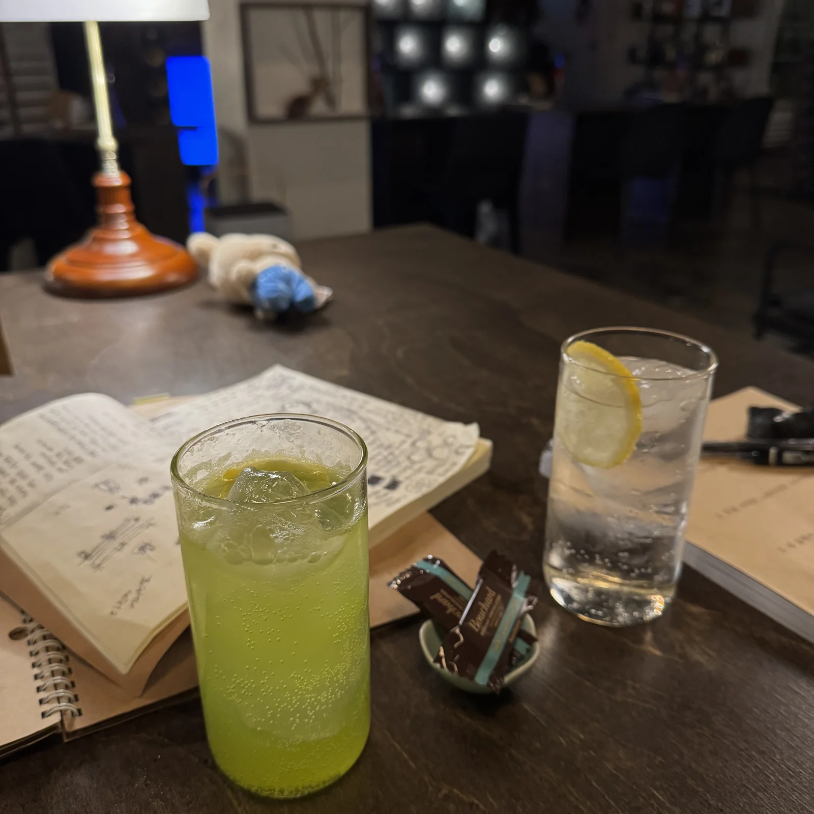 Midori sour and lemon highball beside the guestbook at Jeokon bar