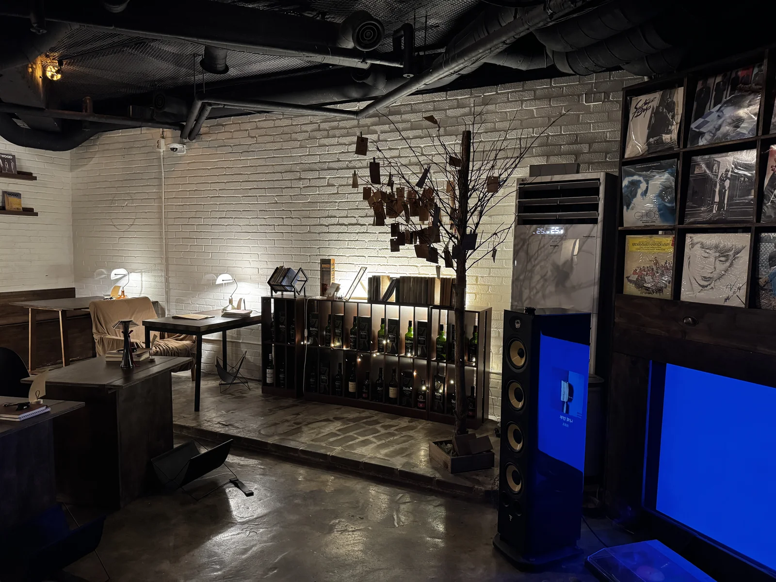 Inside Jeokon, a book bar in Seoul with a wish tree and whisky shelves