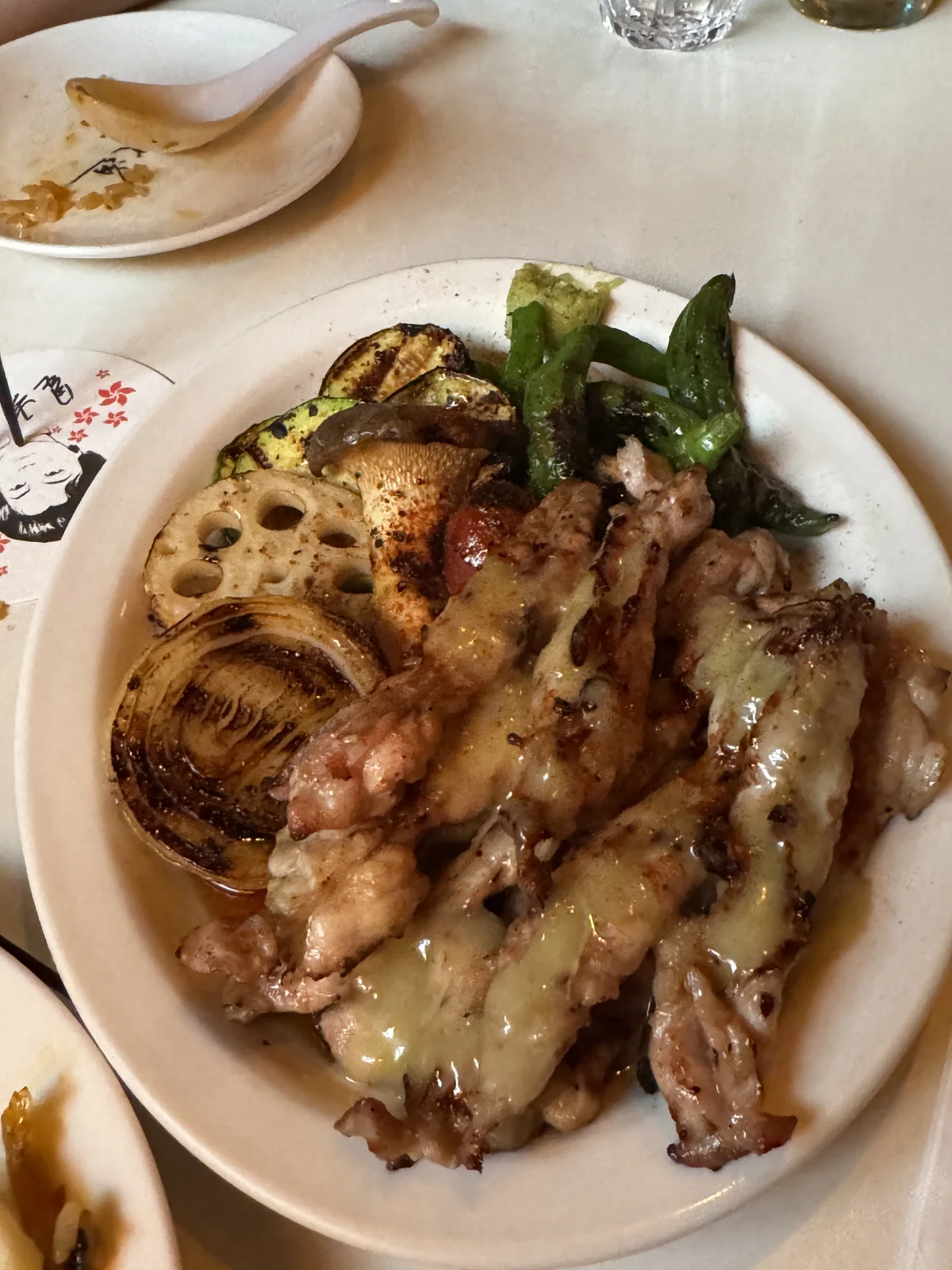Grilled chicken neck with charred vegetables and melted cheese sauce